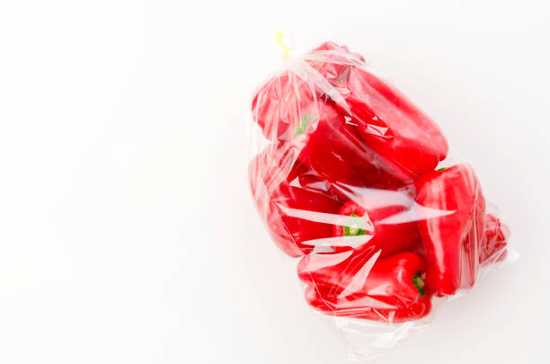istock fresh Red bell pepper in plastic bag on white background 1199233044