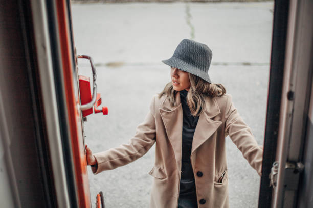 istock Beautiful woman entering to train 1199233084
