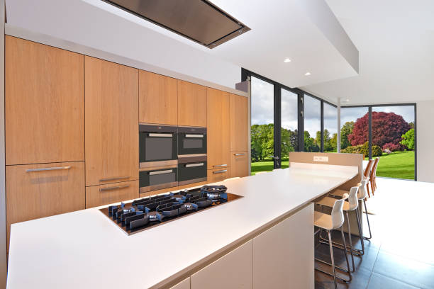 istock Luxurious counter kitchen with lush garden truth windows 1199233121