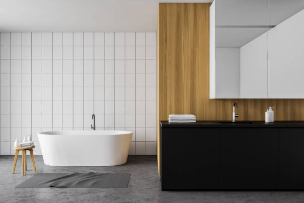 istock White tile and wood bathroom, tub and sink 1199233141