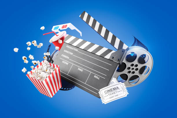 istock Movie clapper board, popcorn and reel on blue 1199233392