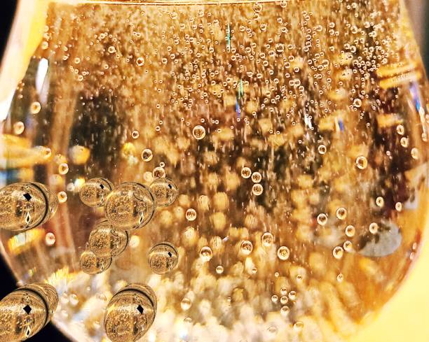 glass of champagne bubbles in a glass of champagne, soda, colored meditation rose champagne stock pictures, royalty-free photos & images