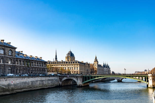 2019 The River Seine in Paris with the Pont de Sully bridge and the Louvre Museum buildings. Paris, France.