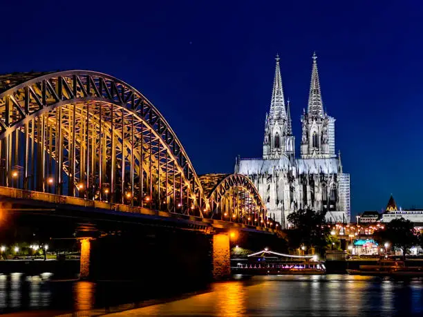 Kölner Dom - Cologne Cathedral Panorama with Hohenzollernbridge and river Rhein at night - longexposure