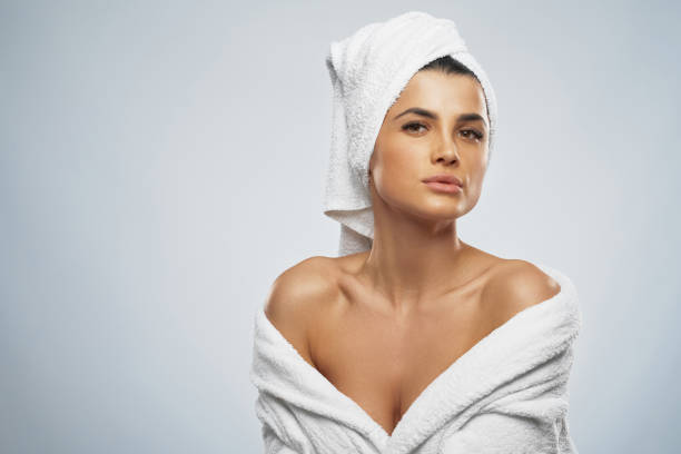 woman posing in bathrobe after shower. - mouth open close up head and shoulders front view imagens e fotografias de stock