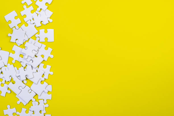 istock Jigsaw puzzles on the yellow background 1199241504