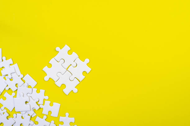 istock Jigsaw puzzles on the yellow background 1199241647