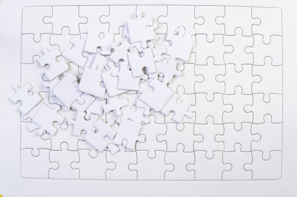 istock White jigsaw puzzles put together Business idea 1199241671