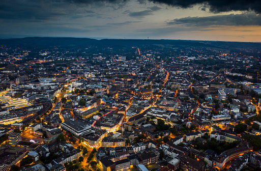 Aerial view of illuminated cityscape of Aachen. Famous Aachen Cathedral in the central of the frame. North Rhine Westphalia in Germany