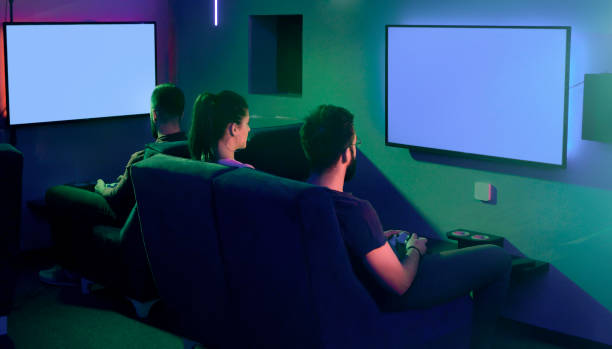 istock Group of friends playing games on big lcd screen 1199241965