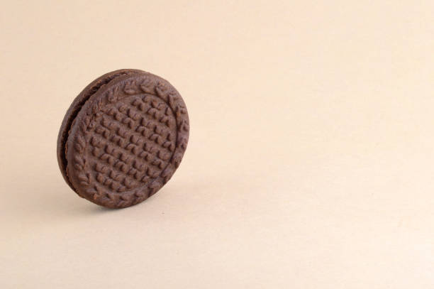 istock brown chocolate sandwich biscuits with cream filling 1199243093