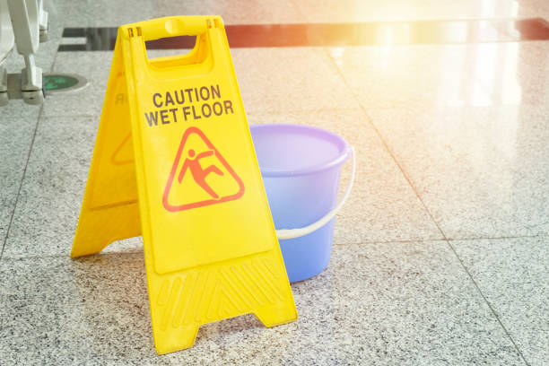 istock cleaning progress caution or wet floor sign in office 1199244662