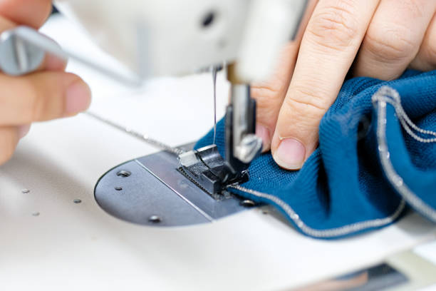 istock Hand and sewing machine of seamstress 1199246297