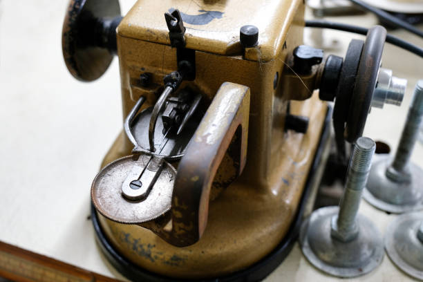 istock Hand and sewing machine of seamstress 1199246301