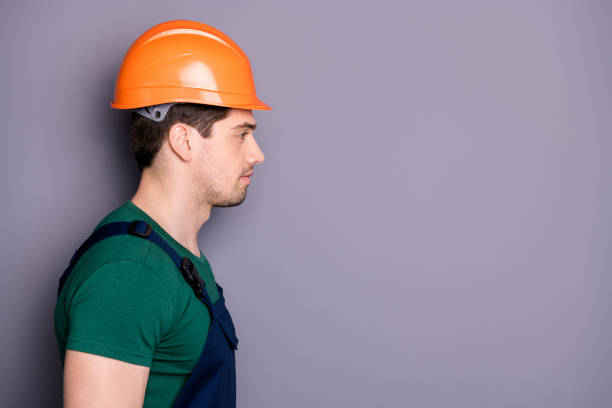 istock Close-up profile side view portrait of his he nice attractive serious experienced qualified skilled content guy craftsman fast refurbishment service isolated over gray pastel color background 1199246582