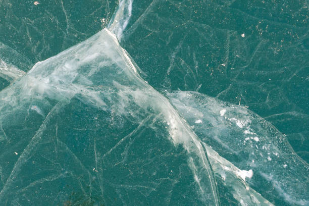 istock Ice texture, background. Top view of empty frozen lake with copy space. 1199248210