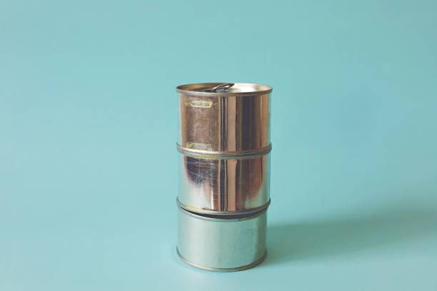 istock Tin can against light blue background for waste recycling concept 1199255698