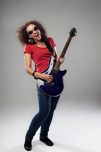 istock Female rockstar playing on guitar 119925684