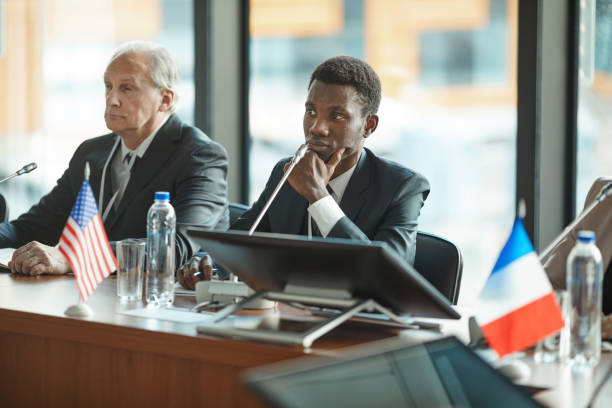 istock Two businessmen sitting at business conference 1199258839
