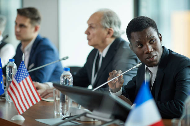 istock Businessman talking to his colleagues 1199258896