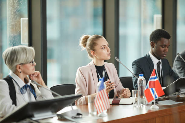 istock Young businesswoman speaking at conference 1199259021