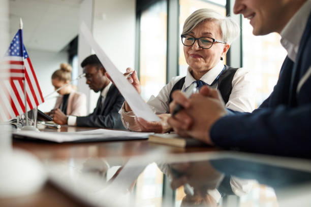 istock Senior businesswoman reading report 1199259131