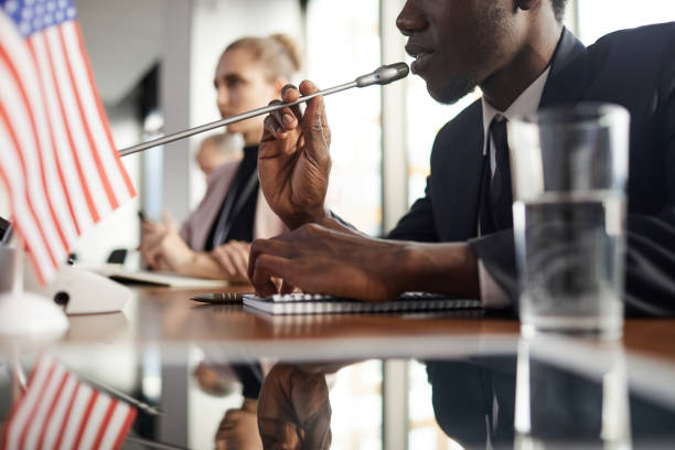 istock Man speaking into the microphone 1199259153