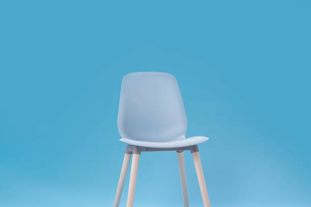 istock Blue classic chair on blue background 1199260316