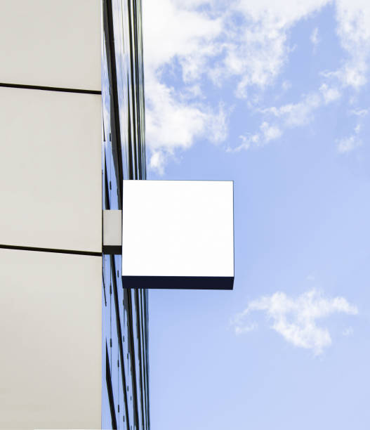istock Blank white square sign on glas wall mockup, sky background 1199261843