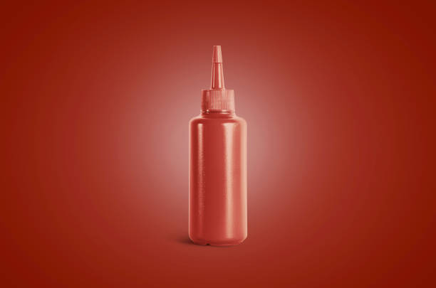 Blank catsup squeeze sauce bottle mockup, red background. Empty sos ketsup souce for hotdog mock up, front view. Chili tomato package for fast food cafe mokcup template.