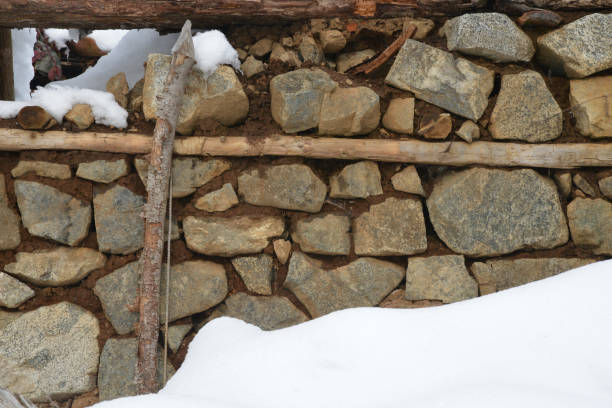 istock old stone wall of stones 1199262260