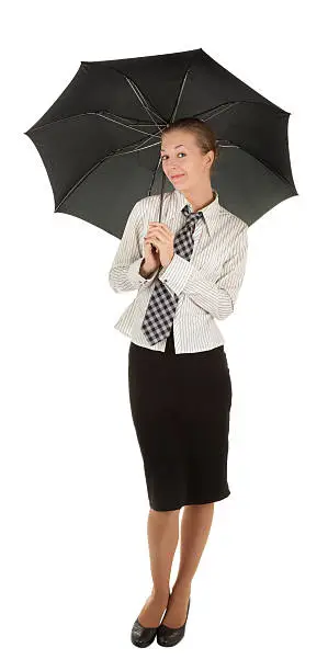 Photo of Young girl in a business suit and carrying an umbrella