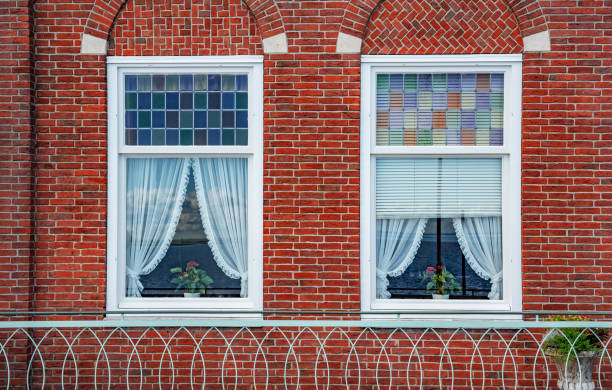 istock Beautiful windows of a brick house. 1199267541