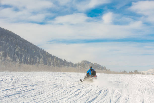 istock Driving snowmobile in Colorado 1199268240