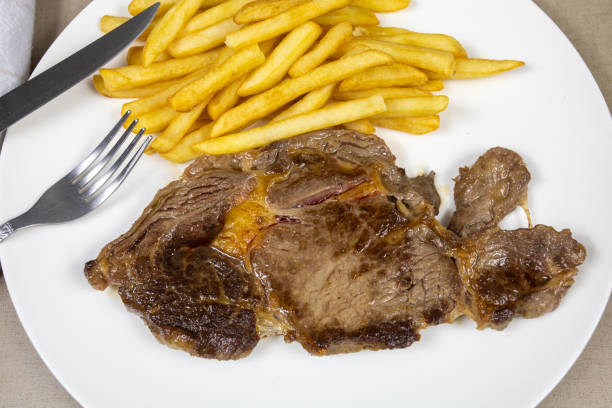 istock steack with fries 1199269142
