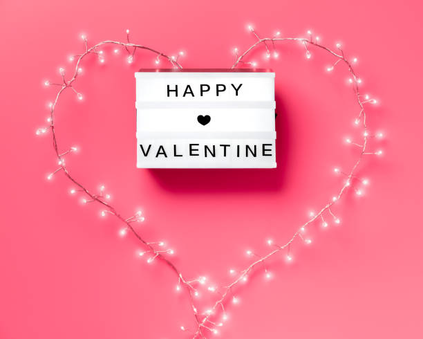 istock Valentine flat lay, top view on pink background. Lightbox with text 