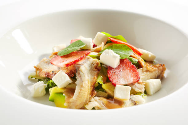 istock Salad with Smoked Eel Fish or Unagi, Avocado and Strawberries 1199274449