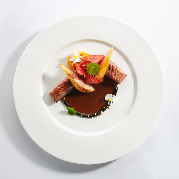 istock Duck Breast with Stewed Pear, Flowers and Strawberries Isolated 1199274472