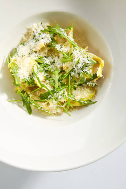 istock Tortellini with 4 Cheeses on White Restaurant Plate Isolated 1199274518