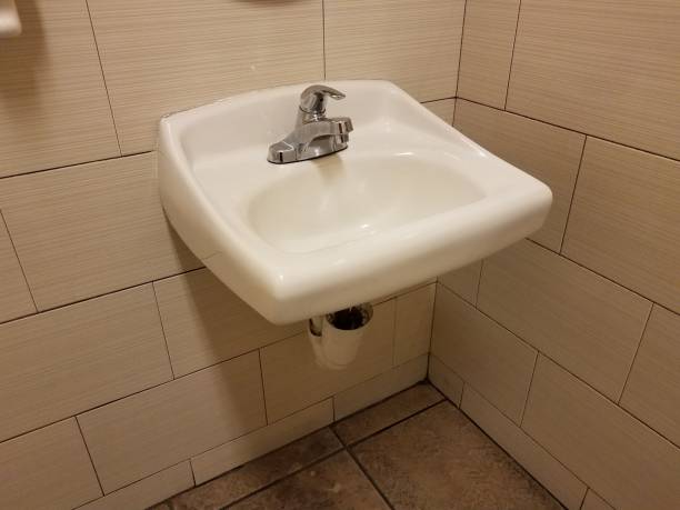 istock white sink in bathroom or restroom with wall tiles 1199274572