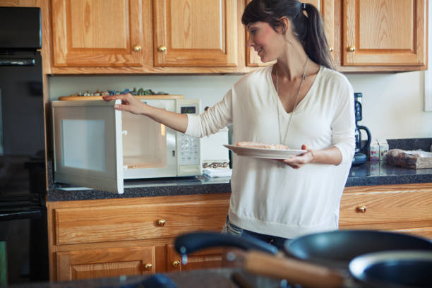 Woman cooking in the kitchen stock photo