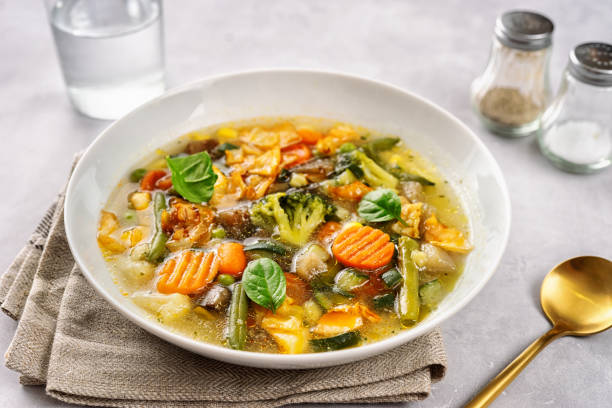 istock Detox vegan vegetable soup on light background 1199276669