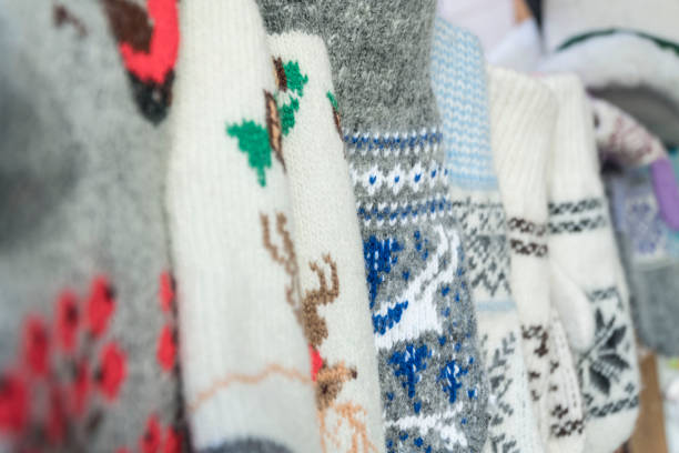 istock handmade, knitted woven socks as a background 1199276697