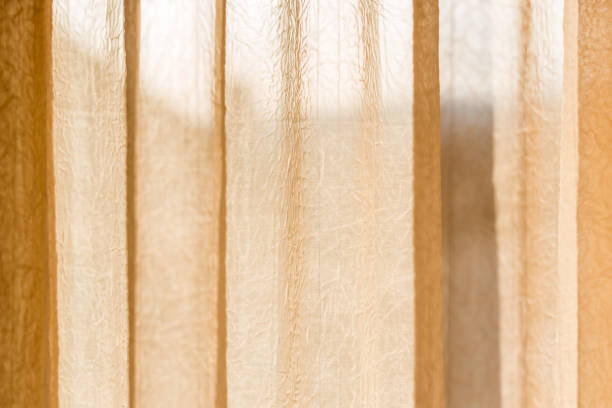 istock Beige translucent curtain with creases 1199277853