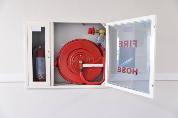 istock Fire Hose Reel And Fire Extinguisher 1199279249