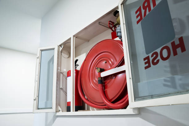 istock Fire Hose Reel And Fire Extinguisher 1199279284