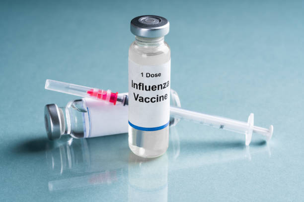istock Influenza Flu Vaccine Vials With Syringe 1199279968