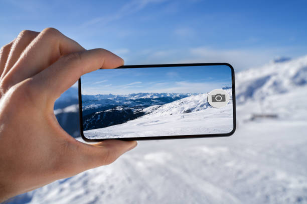 istock Taking Photo Of Snowy Mountains 1199280309