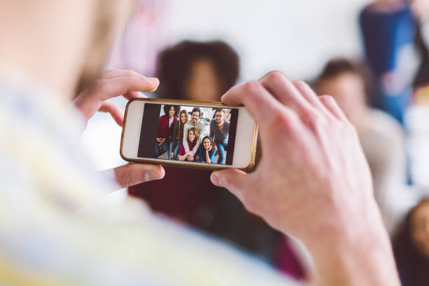 istock Students in the campus taking photos 1199281306