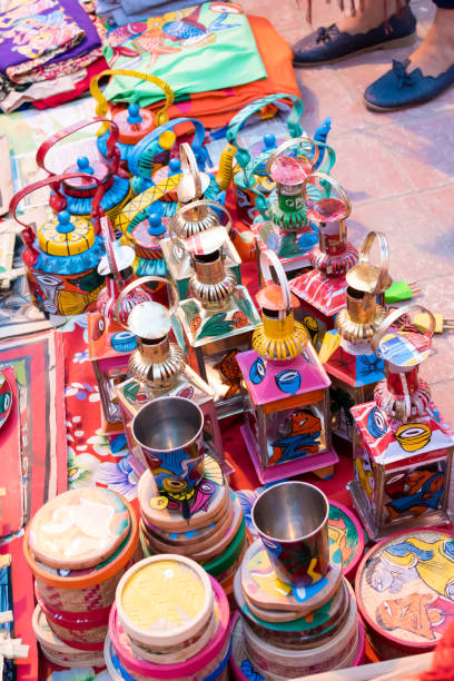 istock Indian traditional handmade monochords isolated on blurred background are displayed in a street shop for sale. Indian handicraft and art 1199283456